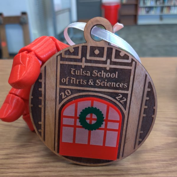 Wood and red acrylic holiday ornament with laser-cut image of TSAS's front door.